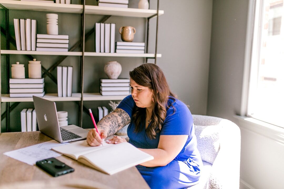 writer at desk with notebook