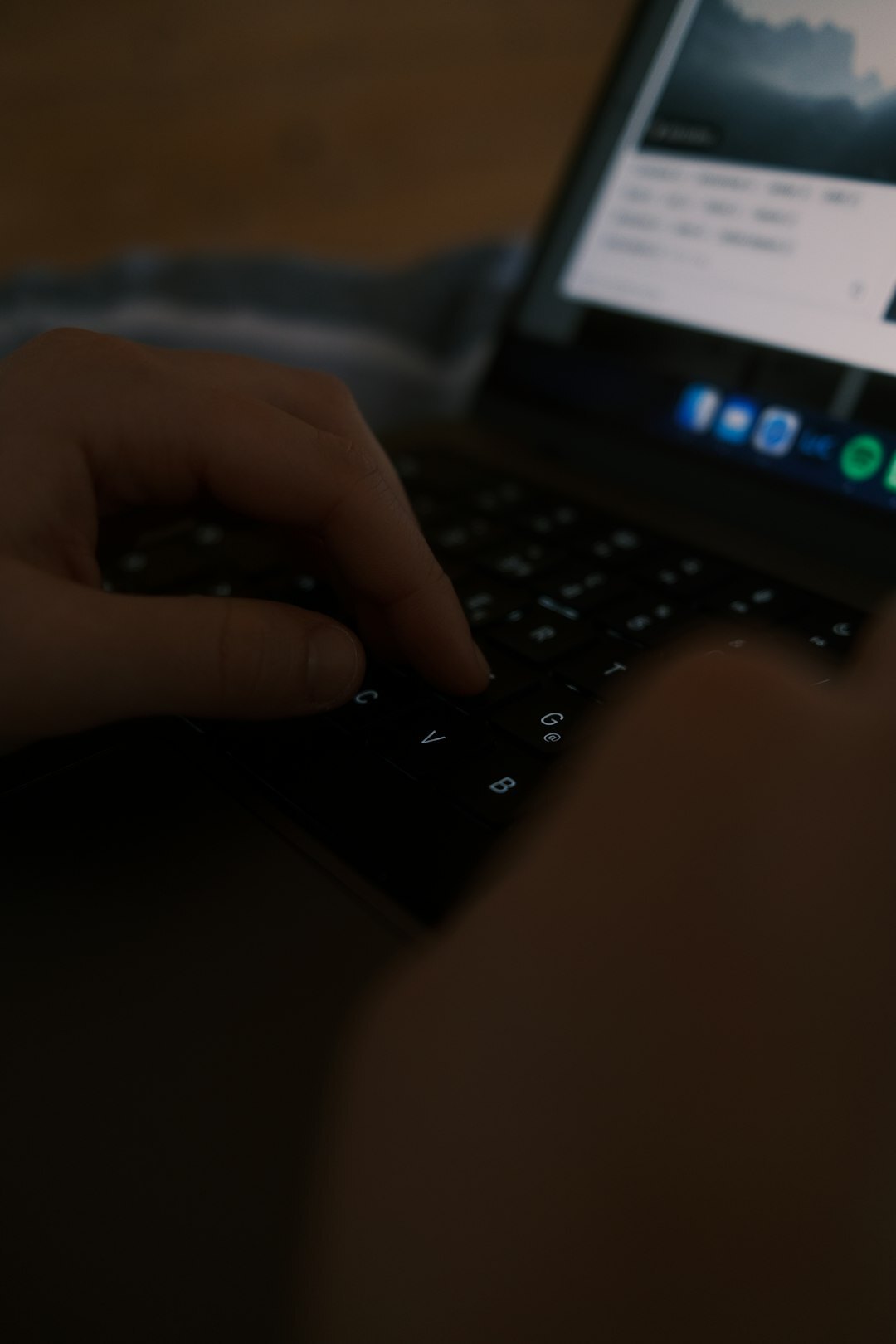 writer typing suspense scene at night