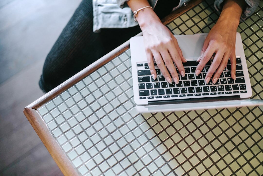 crime writer at laptop